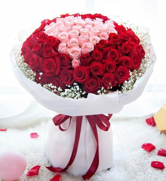 Grand luxury flower bouquet featuring long-stemmed red roses and fragrant lilies for online delivery in Hyderabad