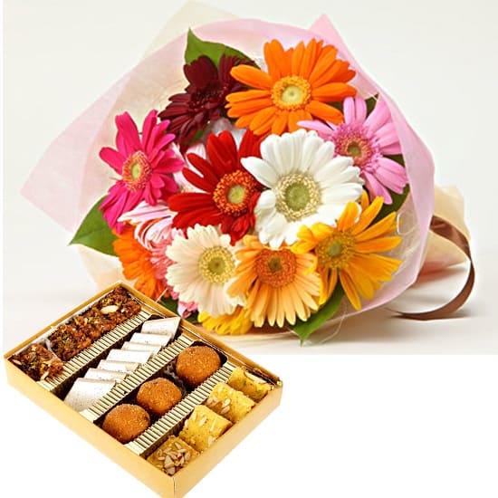 Fresh red rose bouquet paired with an assorted traditional Indian sweet box for delivery in Hyderabad